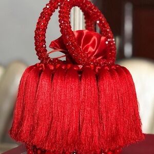 Elegant Red Tassel Handbag…
Bag comes in any color and are custom made.